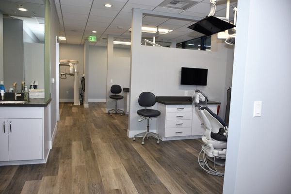 Dental exam room with dental chair at Enamel General and Cosmetic Dentistry in Newport Beach, CA 